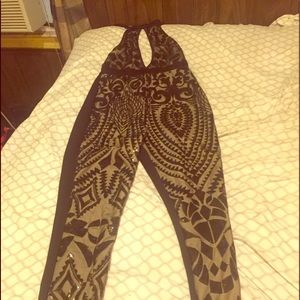 One piece bodysuit/ catsuit. Black and gold